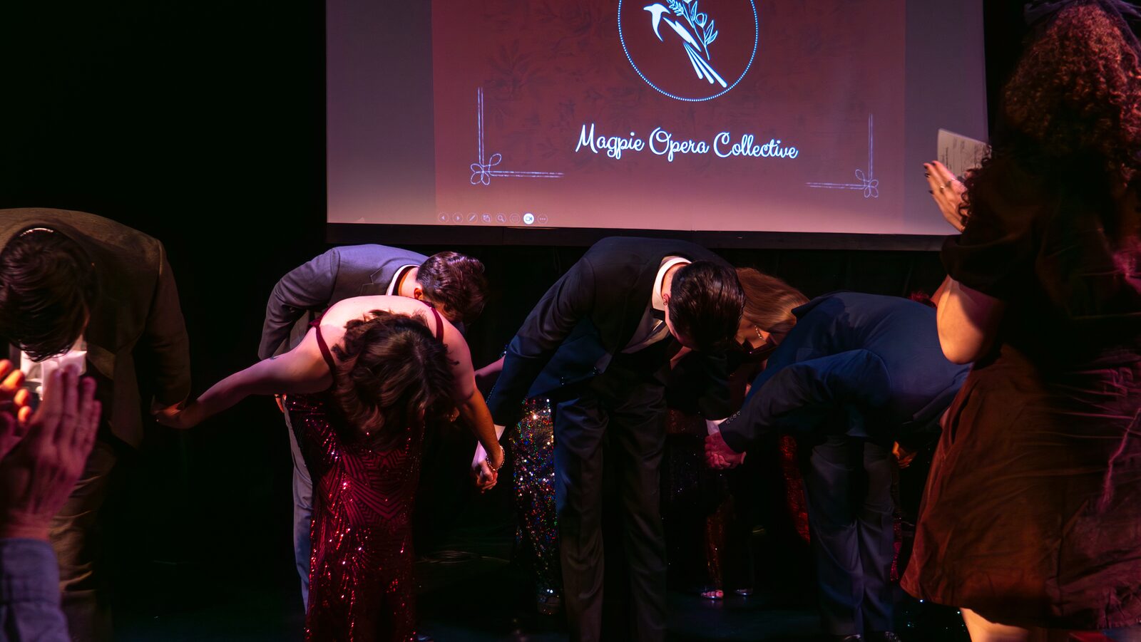 The full cast takes a bow together as the closing screen thanks the audience